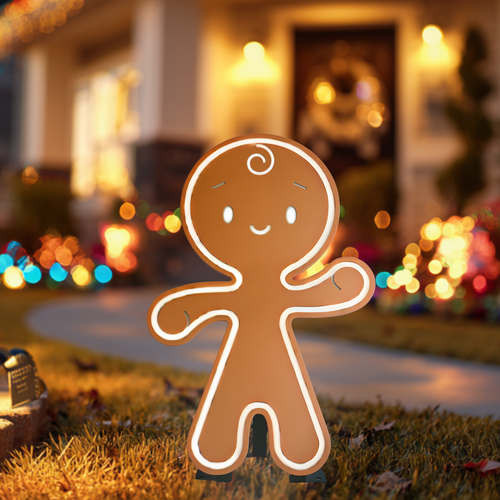 Gingerbread man decoration in front of a house with Christmas lights